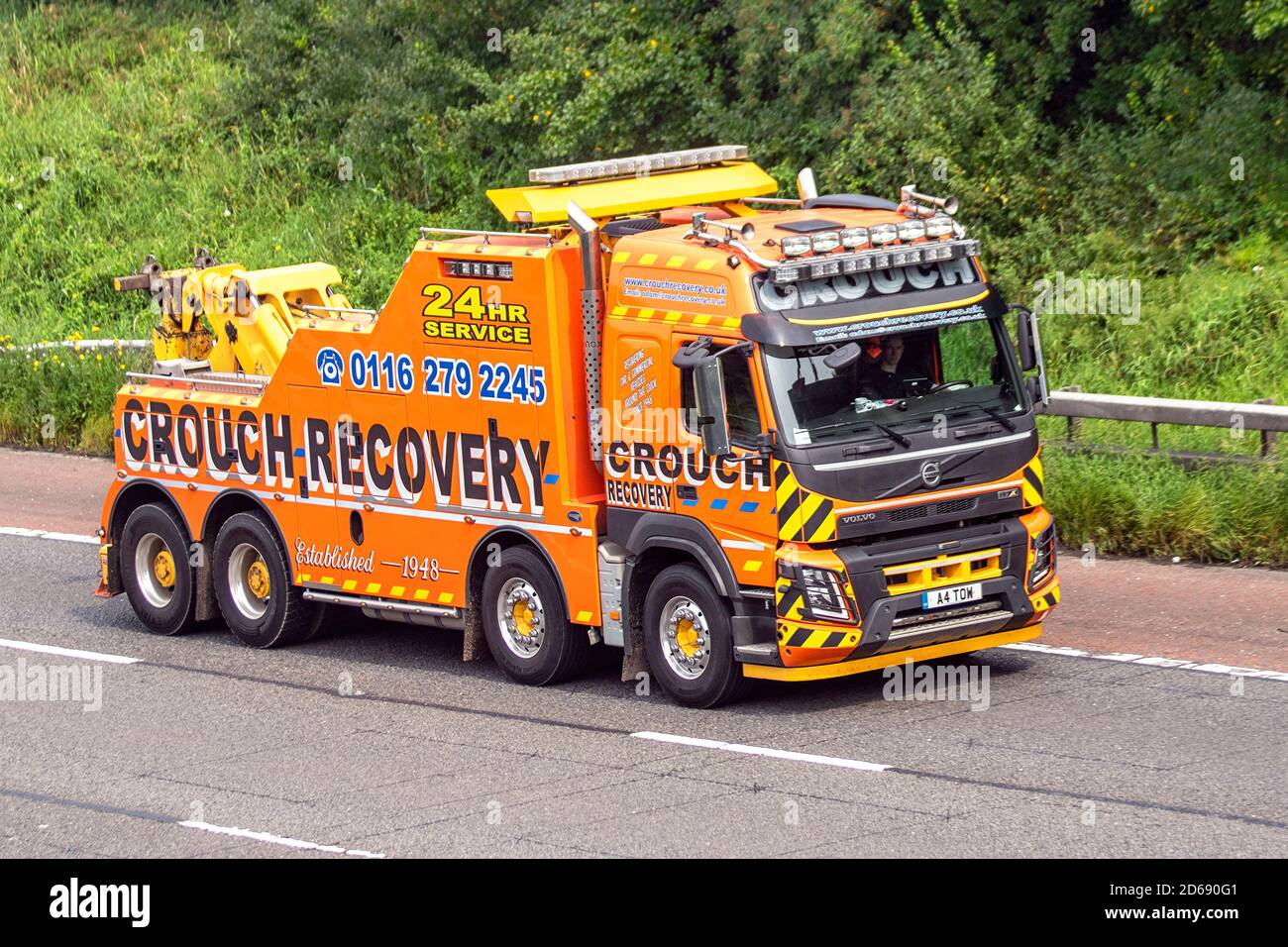 Crouch HGV tow vehicle 24hr service HGV breakdown Recovery operators; Haulage delivery trucks, lorry, transportation, emergency rescue truck, cargo carrier, Volvo vehicle, European commercial transport industry, travelling on the M61 at Manchester, UK Stock Photo