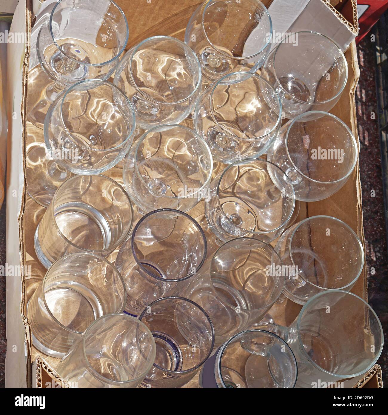 Many drinking glasses collection in crate Stock Photo Alamy
