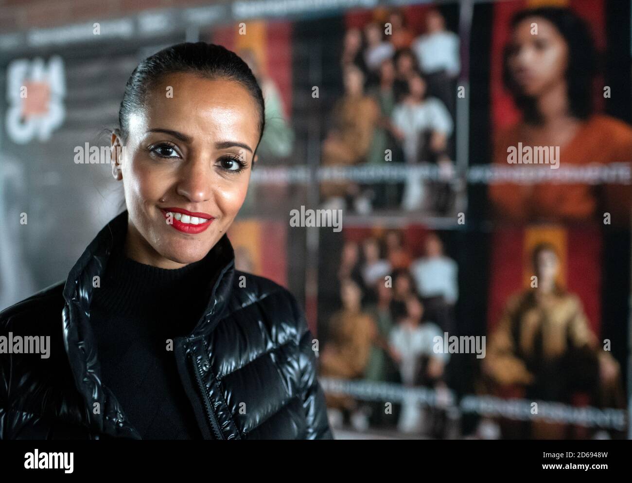 Berlin, Germany. 15th Oct, 2020. Sawsan Chebli (SPD), Berlin State  Secretary for Federal and State Coordination, is standing in front of a  poster with the inscription KEINEEXPERIMENTE. With the poster campaign No