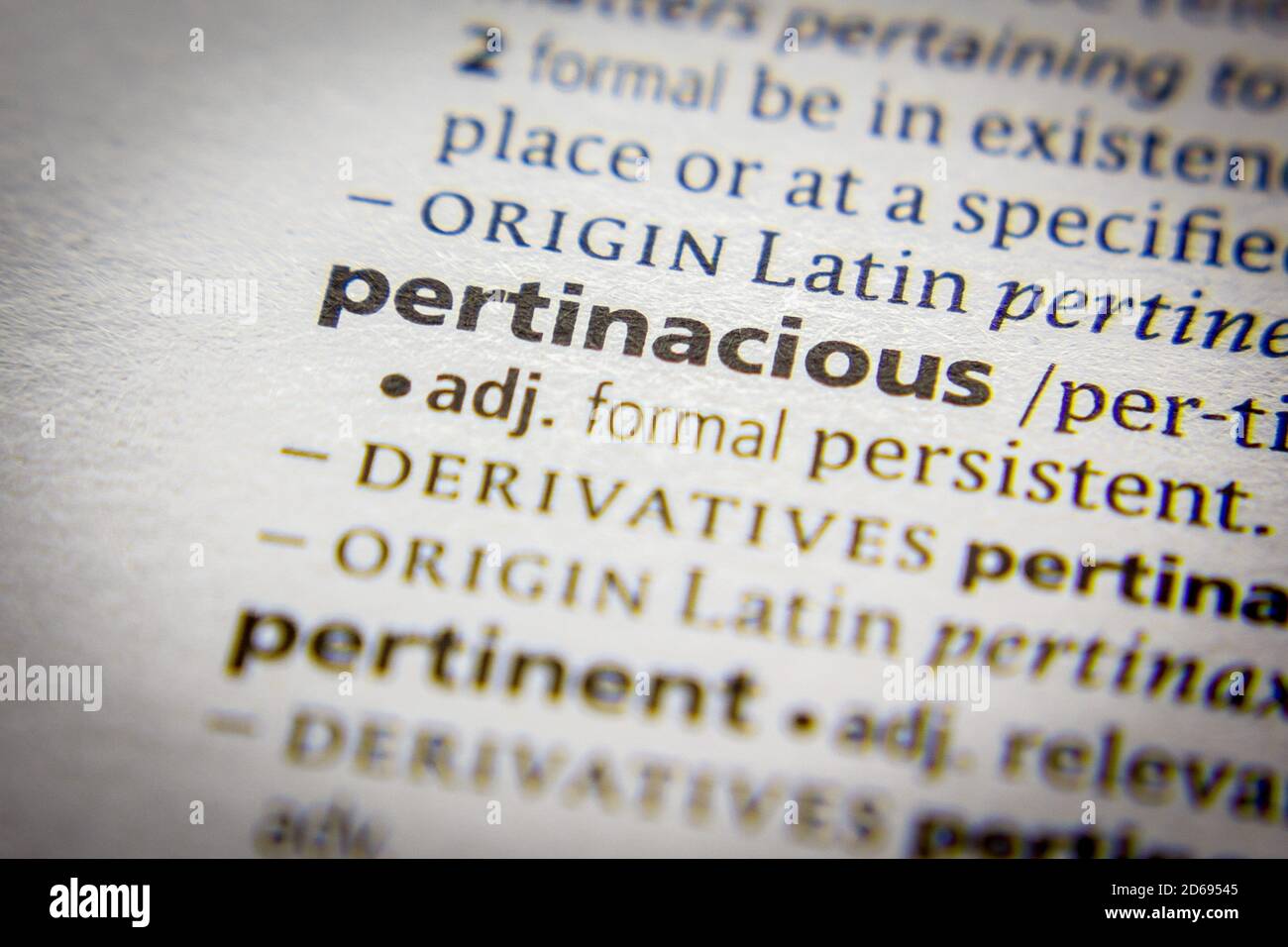 Word or phrase Pertinacious in a dictionary Stock Photo