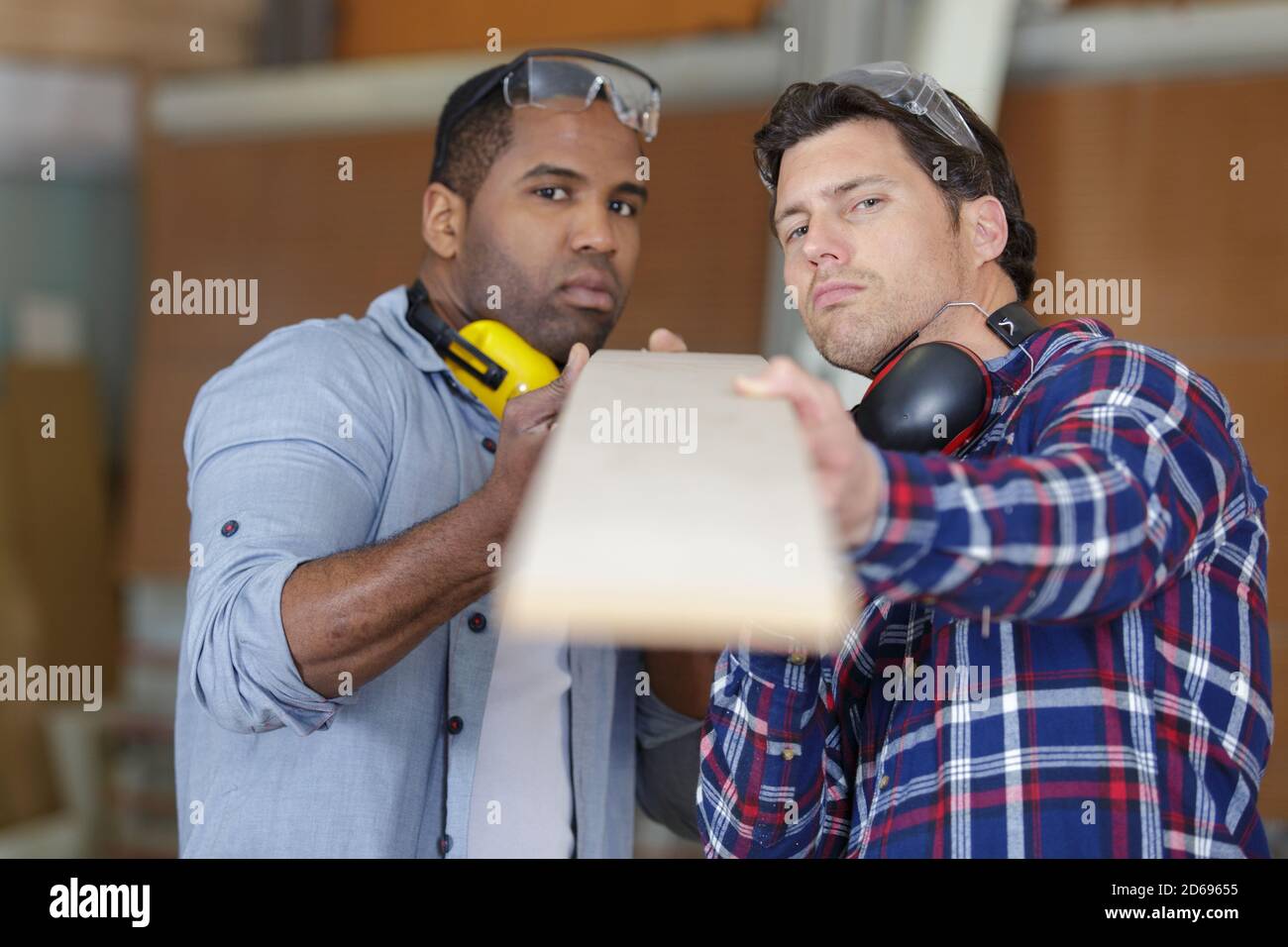 two wood workers in carpentry Stock Photo