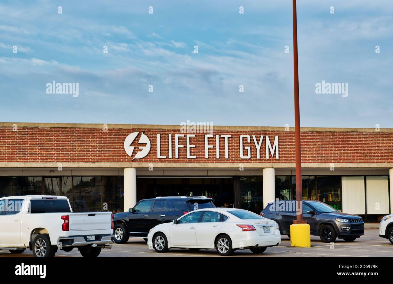 Houston, Texas/USA 10/14/2020: Life Fit Gym building exterior in Houston, TX with vehicles parked in the foreground. Stock Photo