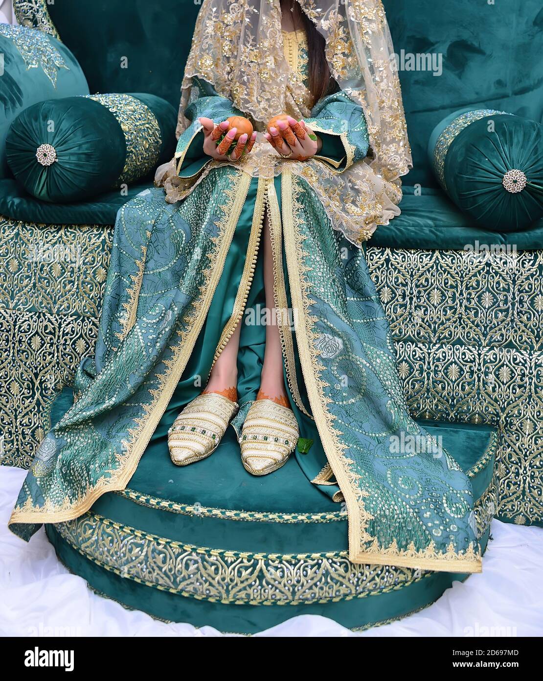 The traditional dress of the Moroccan bride. Beautiful bride wearing Moroccan caftan and precious jewelry Stock Photo