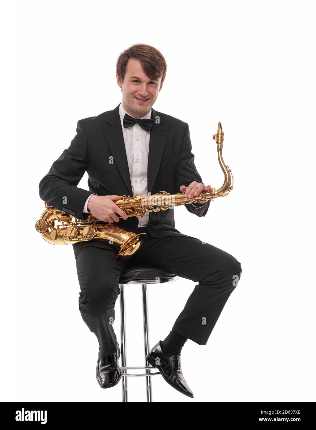Saxophonist with a saxophone in his hands on a white. Stock Photo