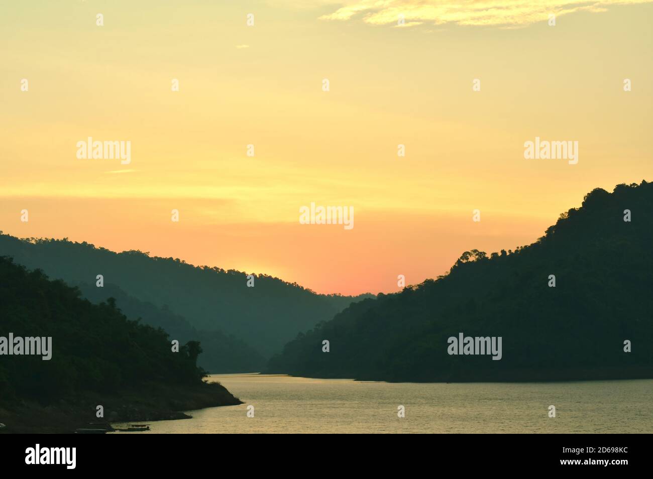 Sunrise behind mountain on river hi-res stock photography and images ...