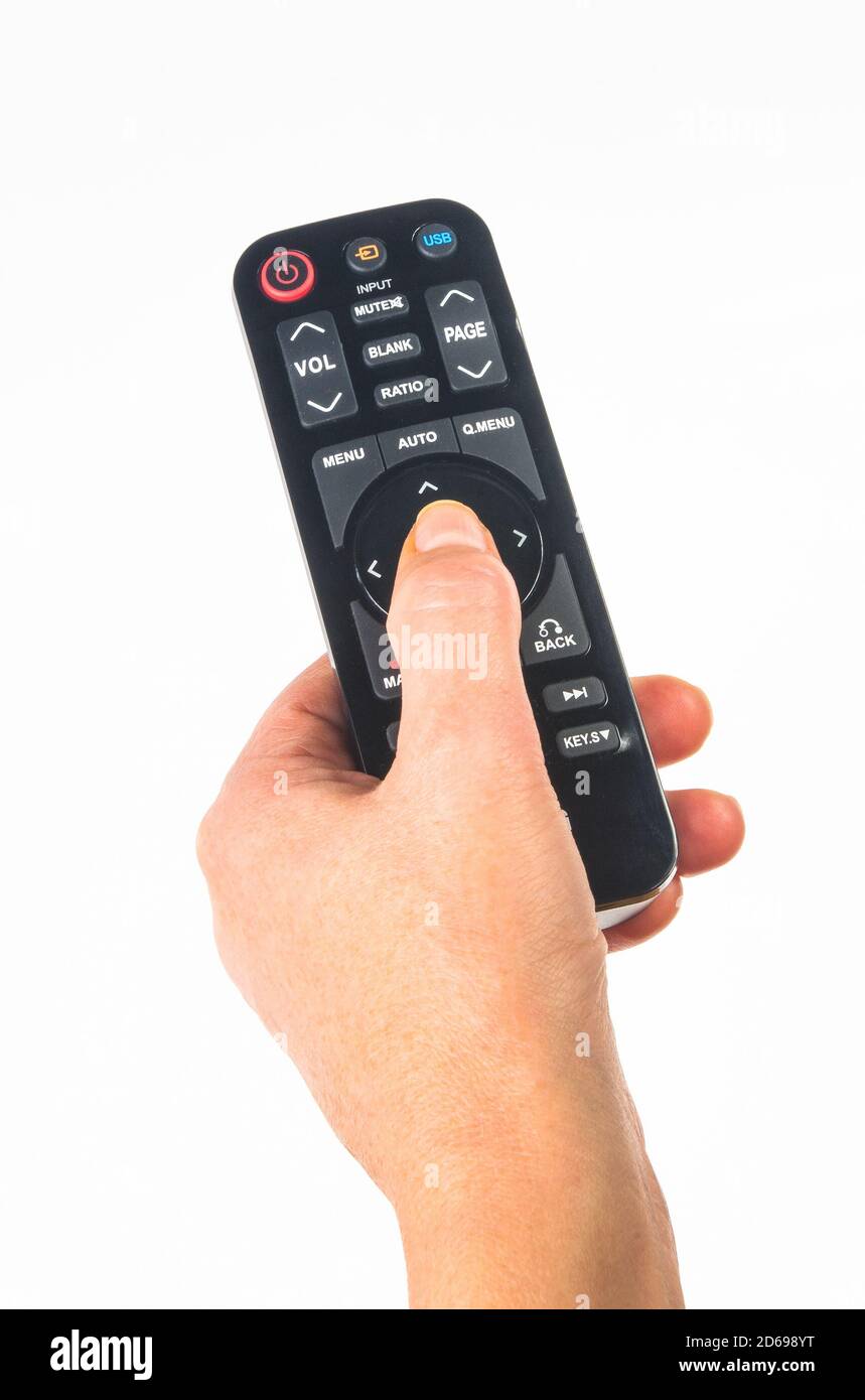 hand holding a remote control on white background, closeup Stock Photo