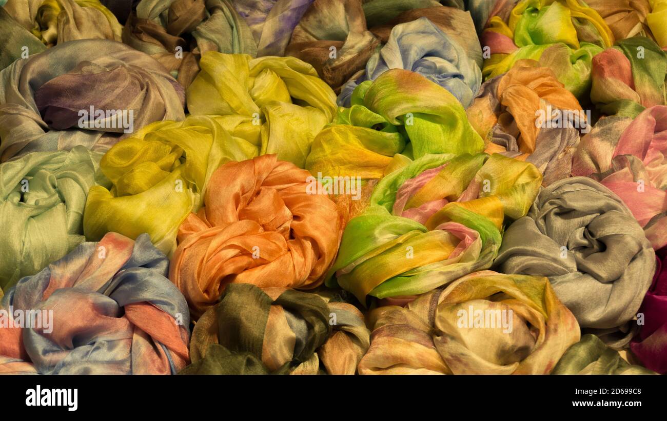 Cravats neckerchief and scarves on the market counter Stock Photo