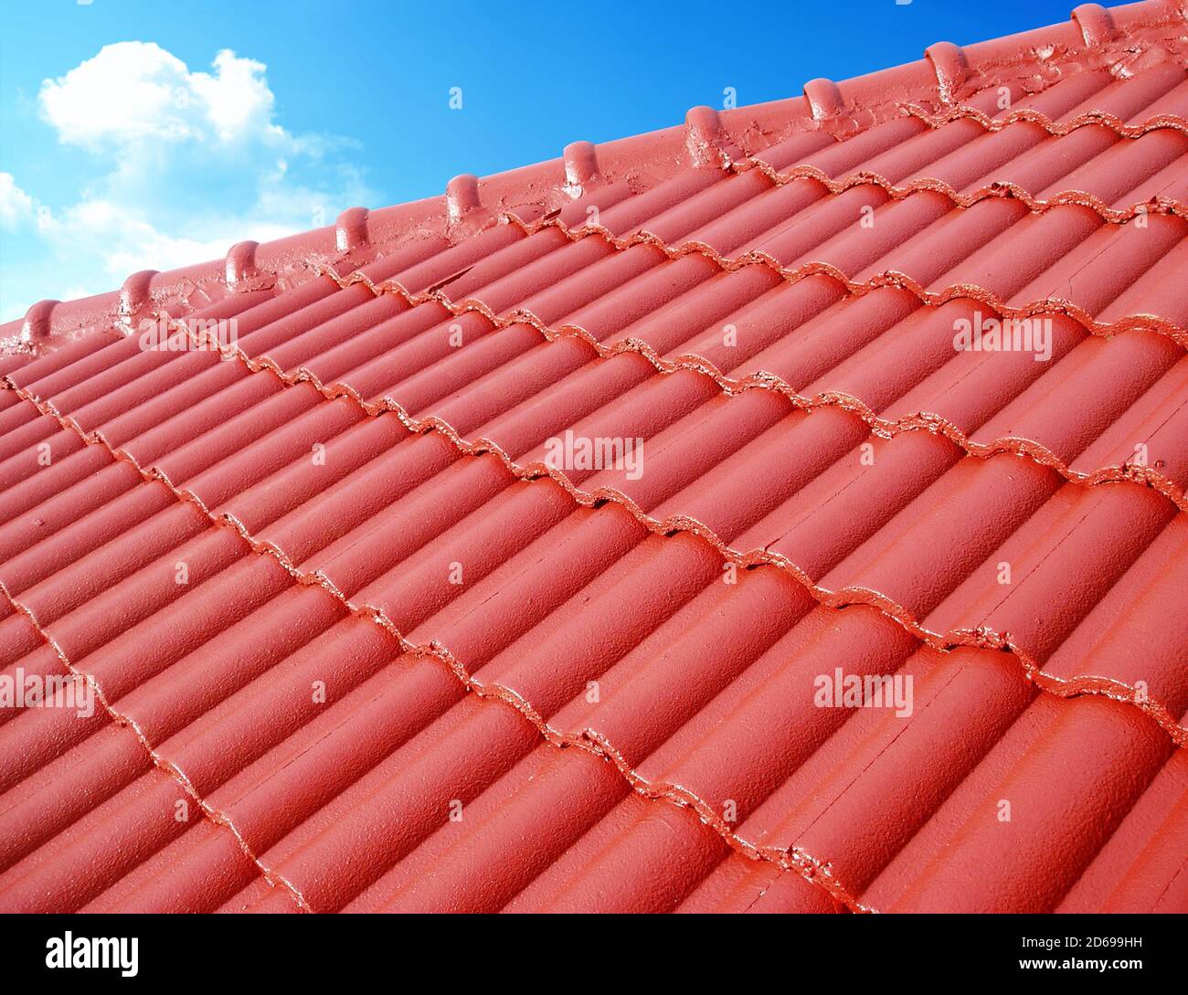 Roof top with ceramic tiles against blue sky Stock Photo