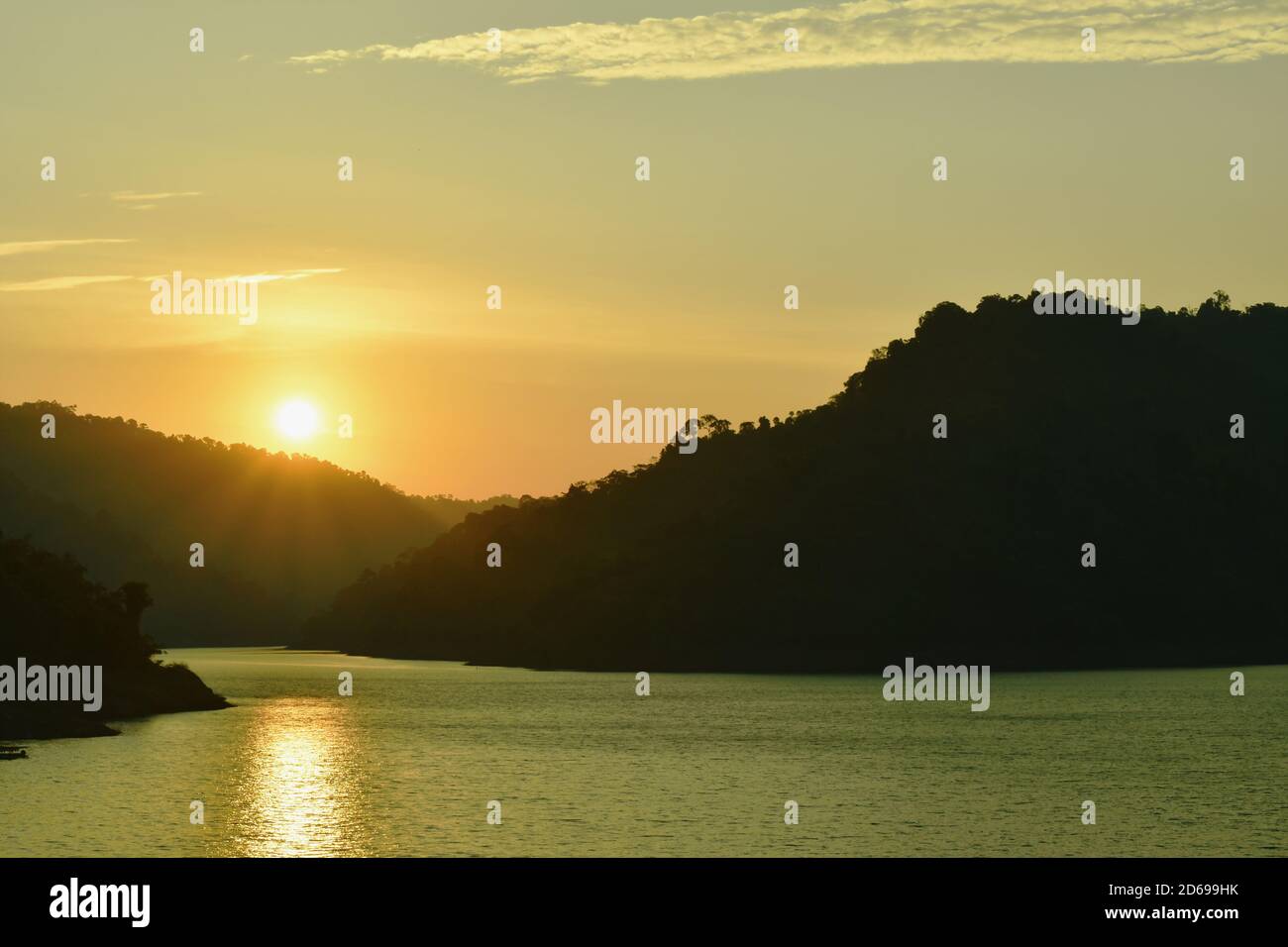 Sunrise behind mountain on river hi-res stock photography and images ...