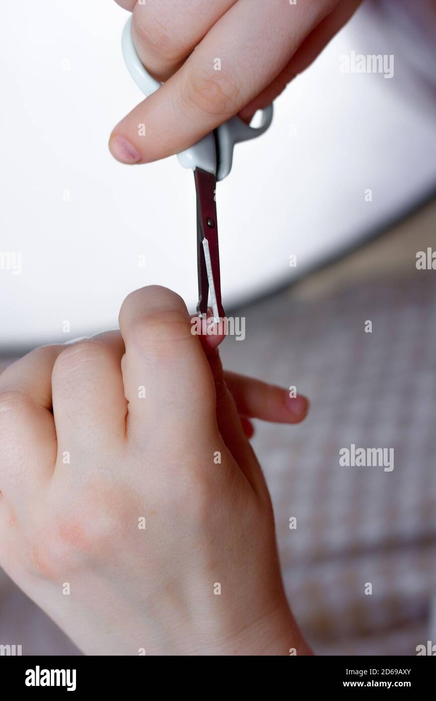 Mother cut nails on finger of baby girl Stock Photo - Alamy Mother cut nails on finger of baby girl Stock Photo - Alamy