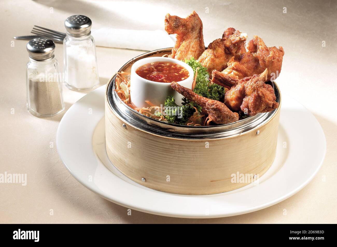 Fried crispy chicken in bamboo steamer with chili sauce Stock Photo Alamy