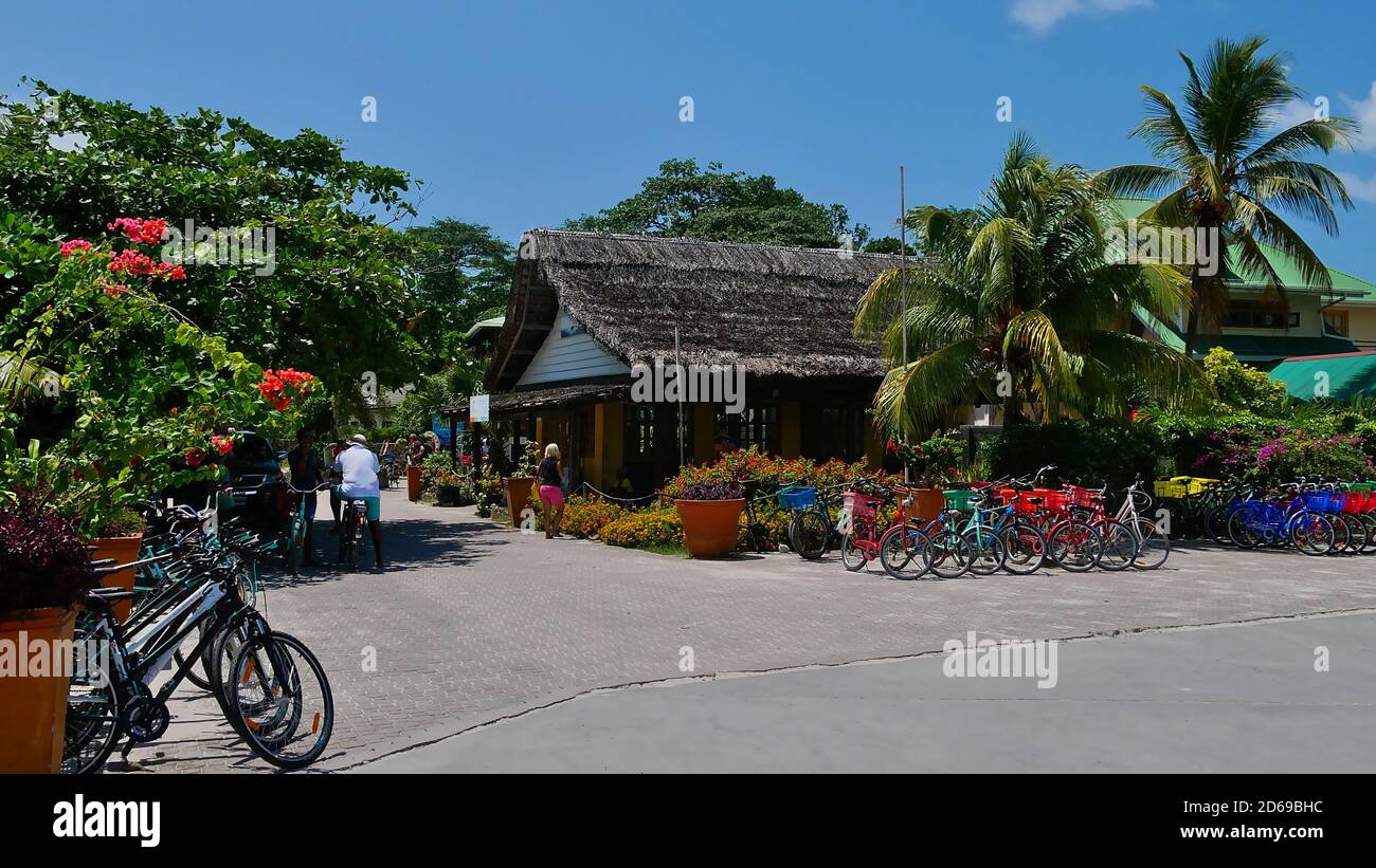 La Digue, Seychelles - 10/01/2018: Bicycles for rental, the main means of transportation on small tropical island La Digue, positioned in the harbor. Stock Photo