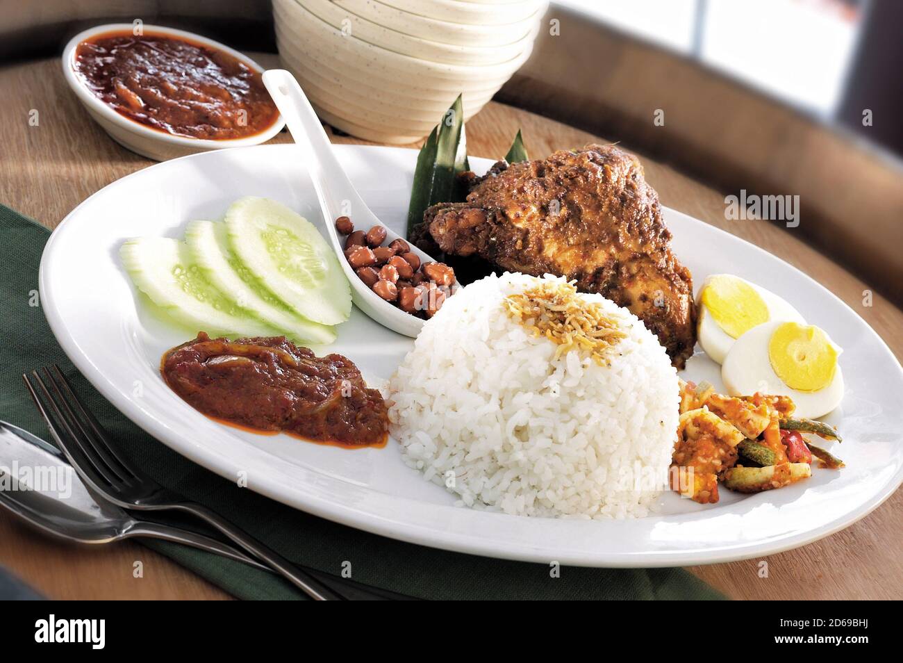 Asian food nasi lemak with chicken rendang Stock Photo