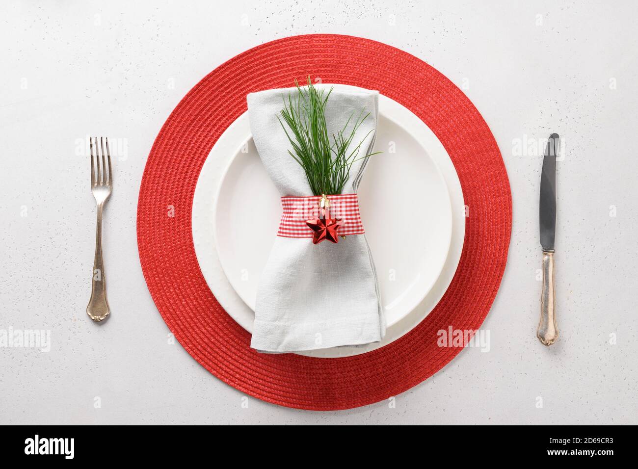 Christmas table setting with white and red decorations. View from above. Stock Photo