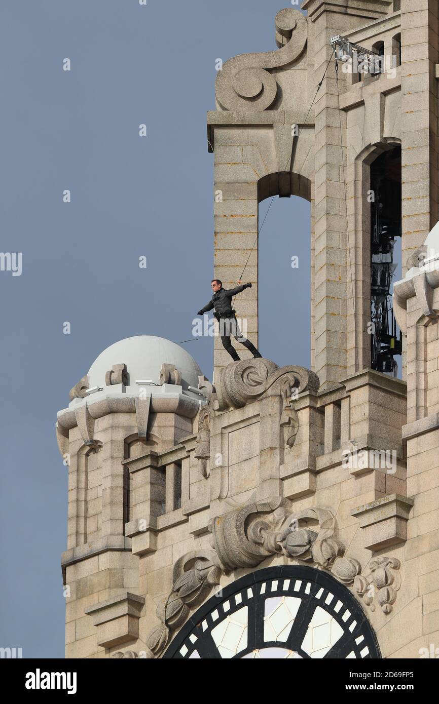 Filming of The Batman with a stuntman on top of The Royal Liver Building in Liverpool. Stock Photo