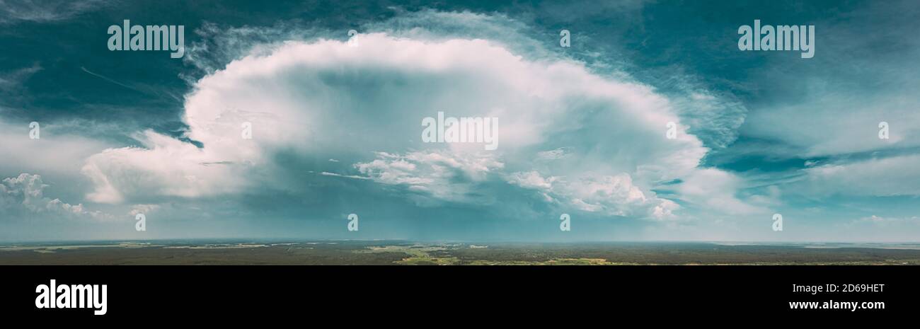 Aerial View. Amazing Natural Dramatic Sky With Rain Clouds Above Countryside Forest Landscape In Summer Cloudy Day. Scenic Sky With Fluffy Clouds On Stock Photo