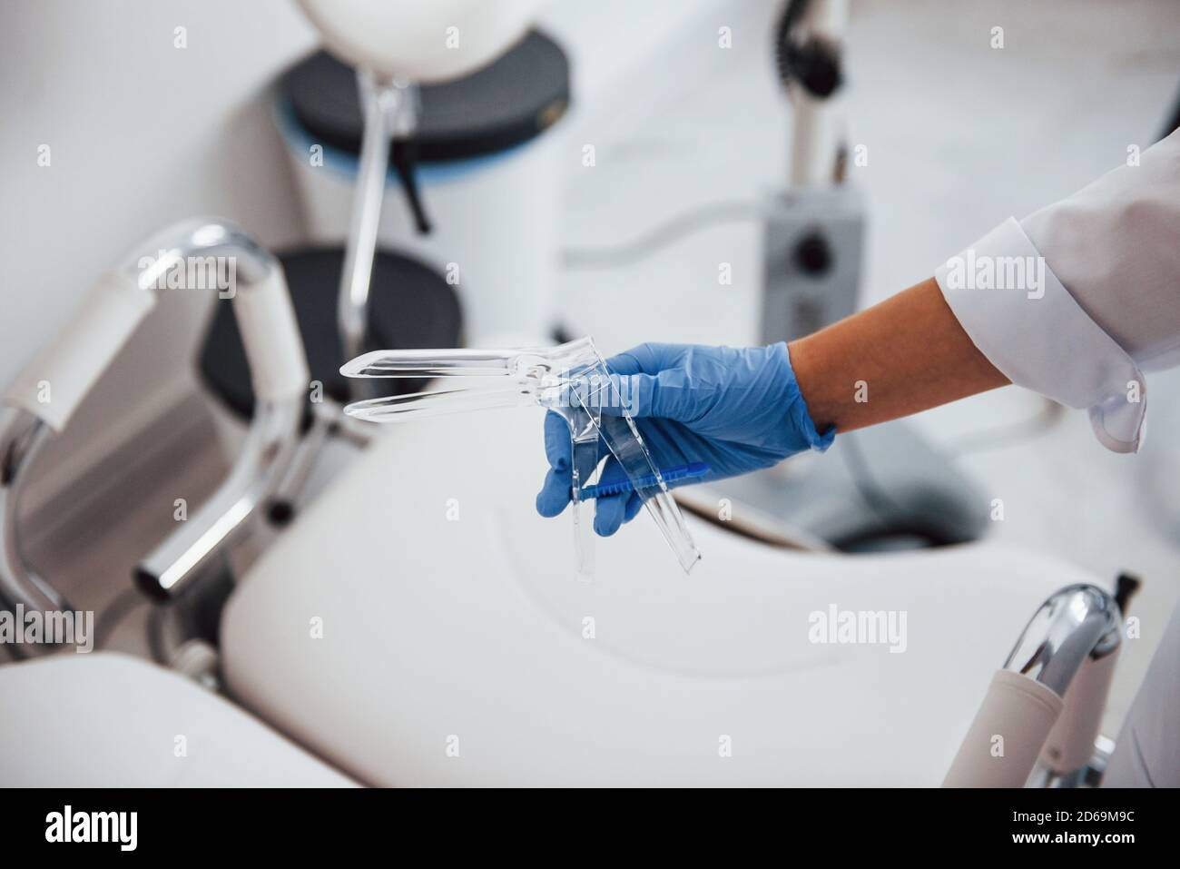 Close up view of female doctor hands that holds speculum instrument Stock Photo Alamy