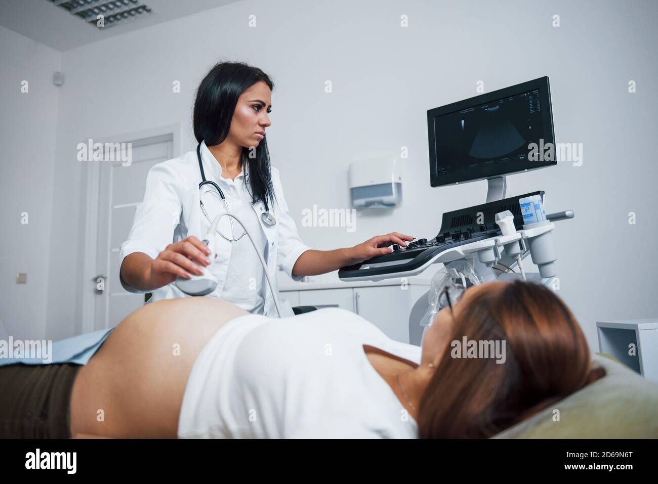 female-doctor-does-ultrasound-for-a-pregnant-woman-in-the-hospital