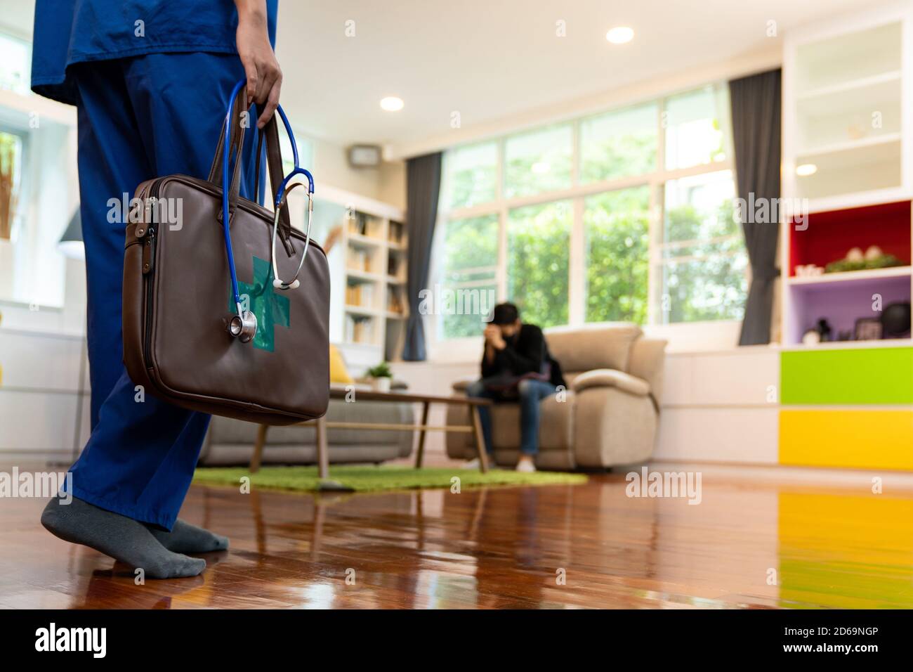 Close up female doctor in hospital uniform with background of asian man