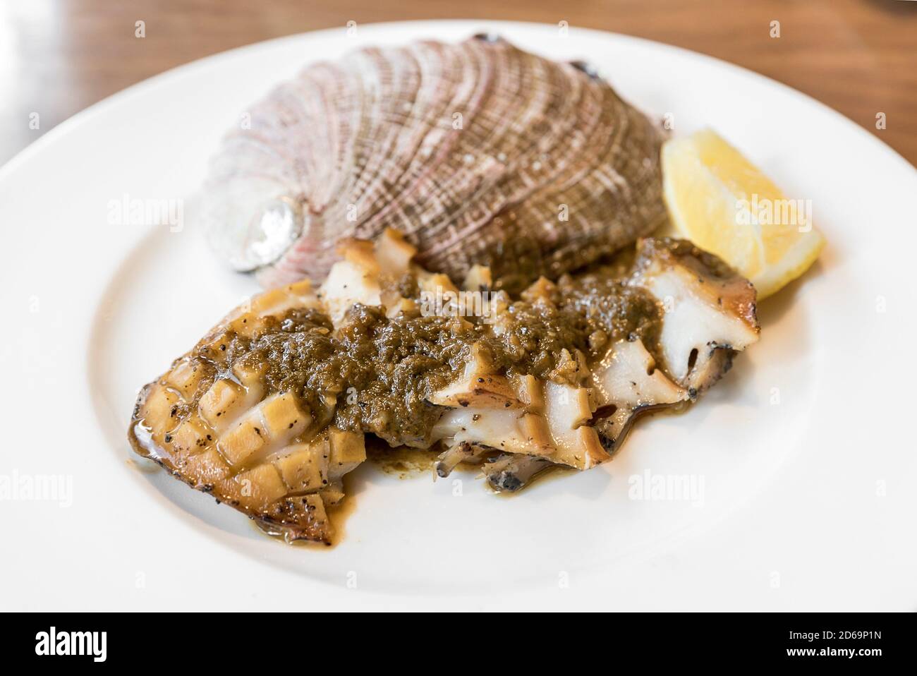 grilled Japanese Abalone steak with lemon Stock Photo Alamy