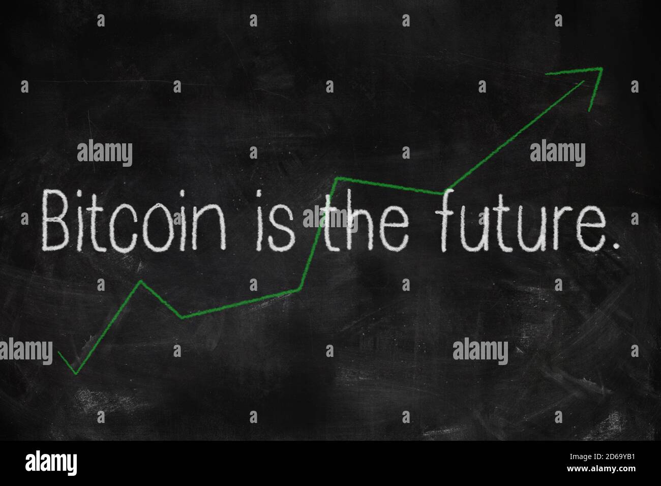 Bitcoin is the future written with white and green chalk on blackboard in classroom Stock Photo