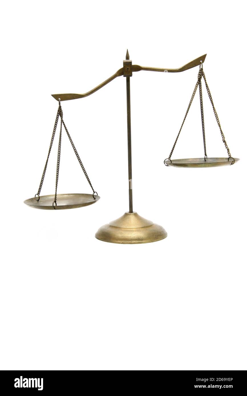 unbalance of golden brass scales of justice on white Stock Photo Alamy