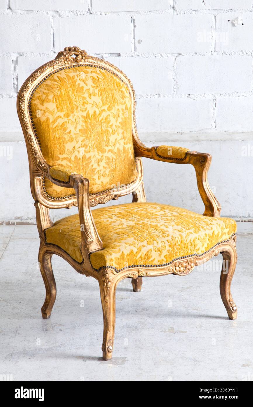 Vintage luxury Yellow sofa Armchair in white brick wall room Stock Photo -  Alamy