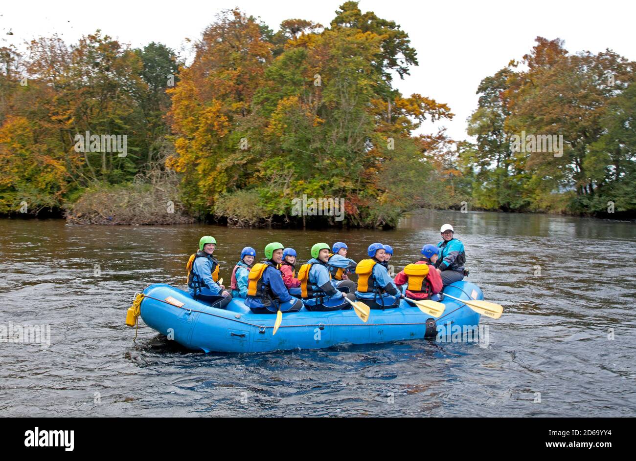 Aberfeldy, Perthshire, Scotland, UK. 15 October 2020. Cloudy weather did not matter to this group of people setting out on a White water rafting adventure on the River Tay surrounded by autumn colour. Credit: Scottishcreative/Alamy Live News. Stock Photo