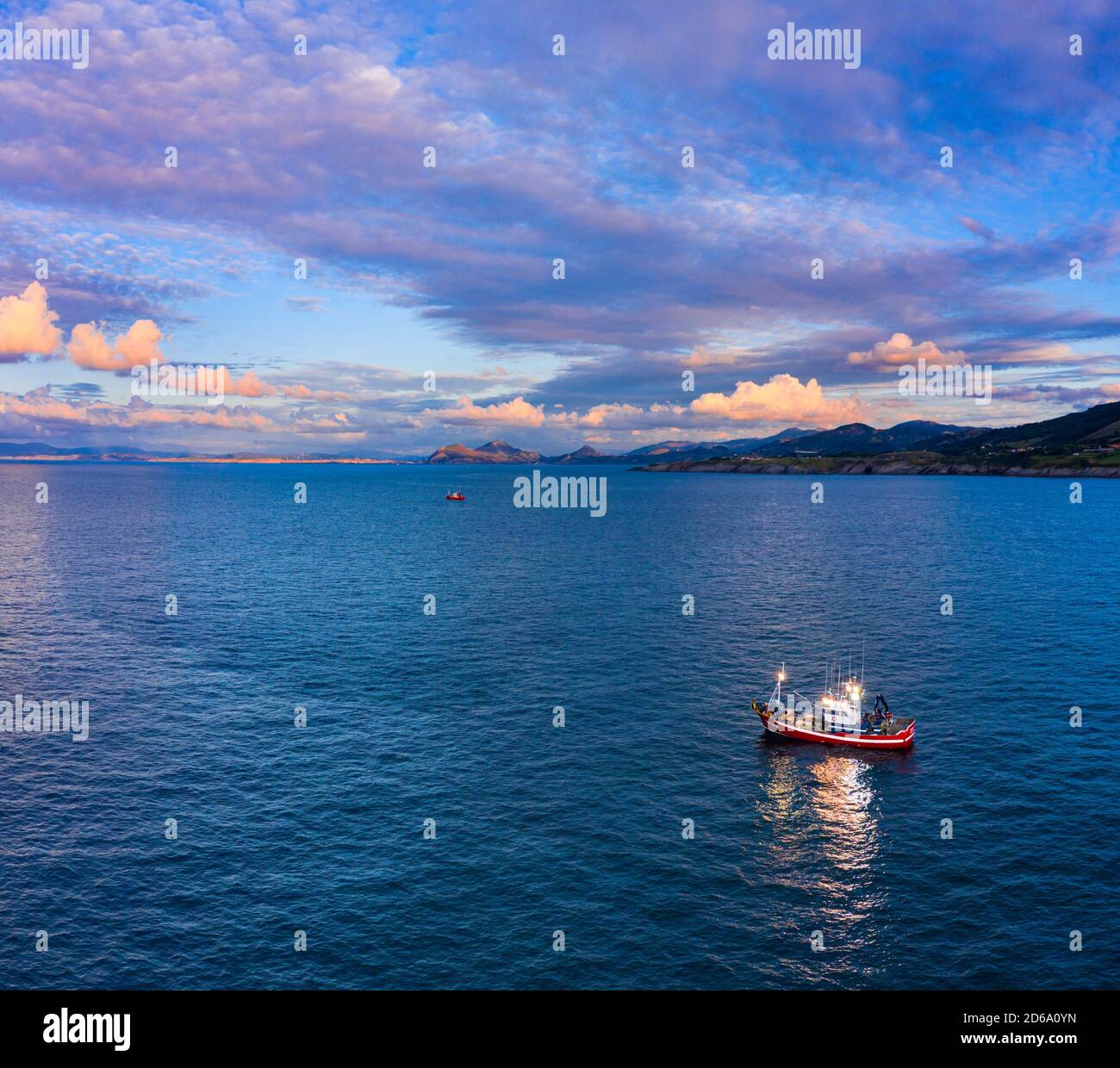 Fishing boat fishing in the Cantabrian Sea between Cerdigo and Castro Urdiales. Cantabria, Spain, Europe. Stock Photo