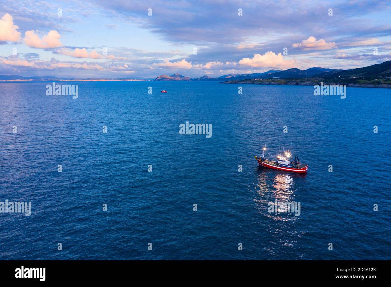 Fishing boat fishing in the Cantabrian Sea between Cerdigo and Castro Urdiales. Cantabria, Spain, Europe. Stock Photo