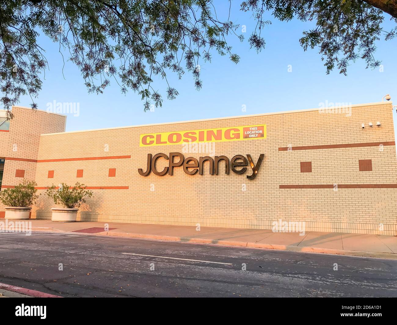 Closing sign at facade building of J.C. Penney retail store in shopping