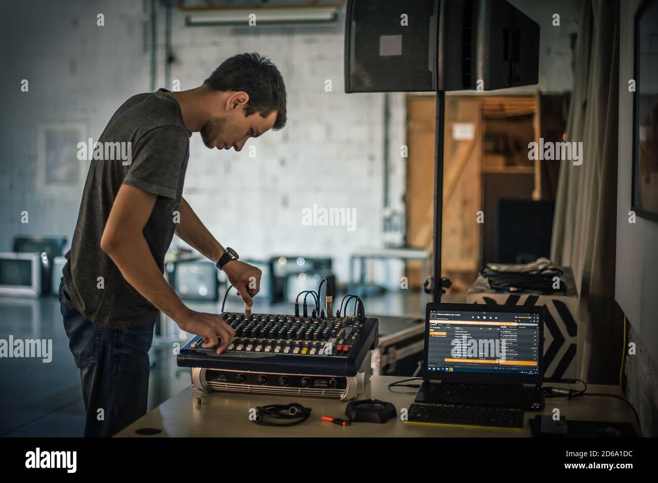 Behind the scene. Sound technician electric engineer adjusting sound