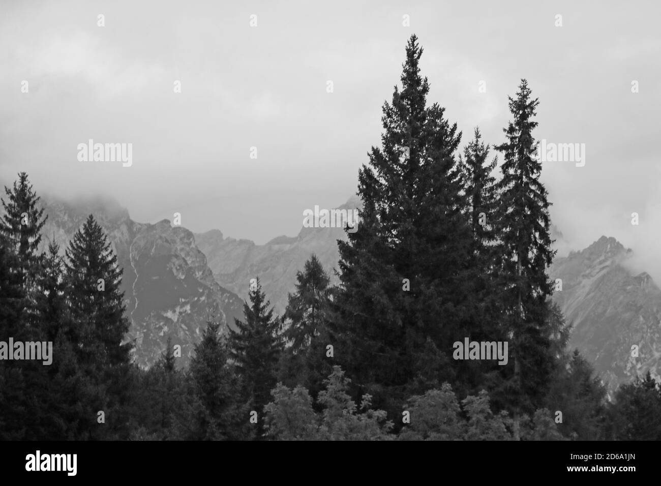 Picturesque landscape of foggy morning in mountain village in Dolomites Alps, selective focus Stock Photo