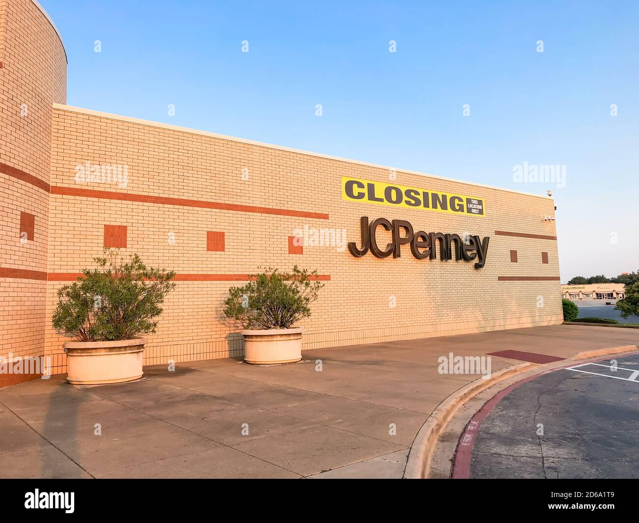 Closing sign at facade building of J.C. Penney retail store in shopping
