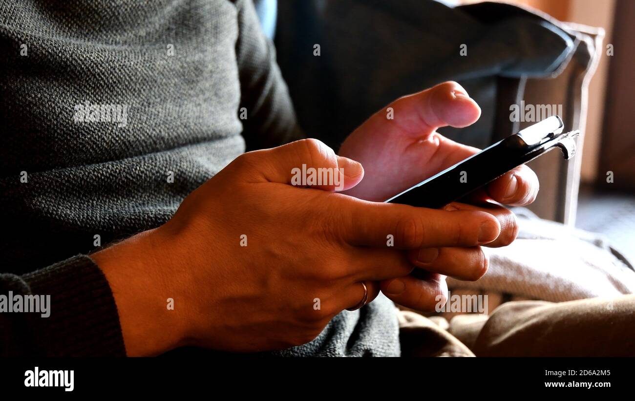 Closeup male hands scrolling typing hi-res stock photography and images ...
