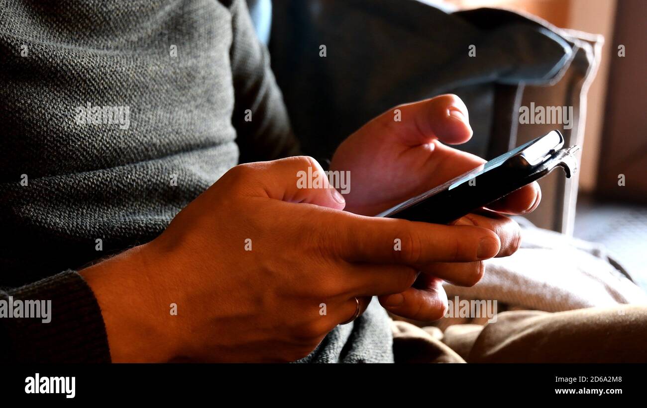 Closeup male hands scrolling typing hi-res stock photography and images ...