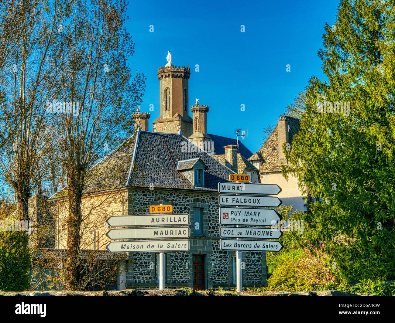 road signs with Notre Dame de Lorette church, Salers, Cantal Department, Auvergne region, France. Stock Photo