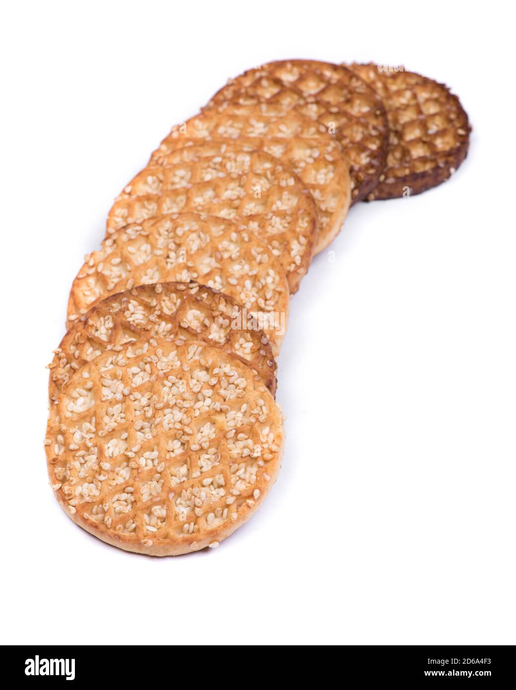 Crunchy cookies with waffle texture and sesame seeds isolated over white background Stock Photo