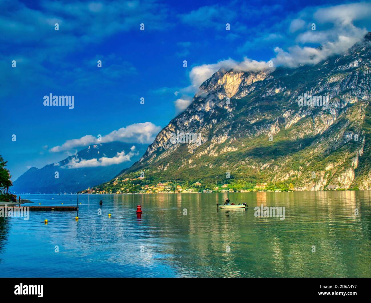 man in a boat on Lake Lugano at Porlezza, Lombardy Region, Italy. Stock Photo