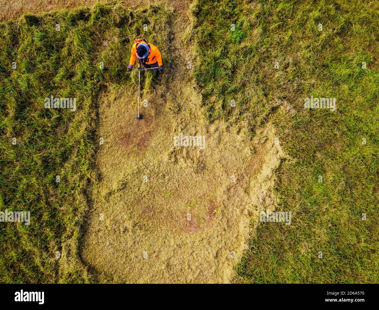 Grass cutter in action. Aerial view Stock Photo Alamy
