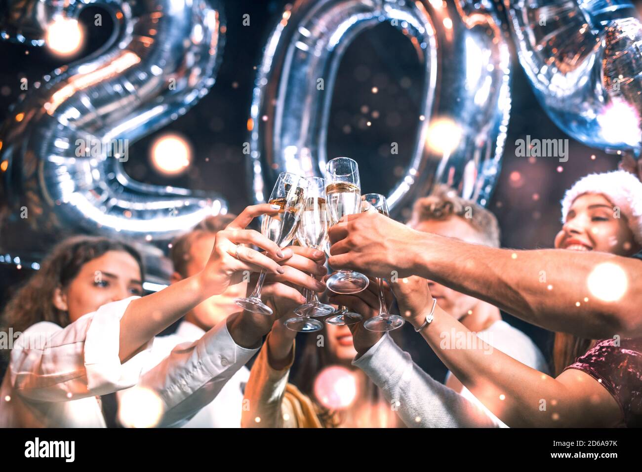 Positive young people holds balloons with new 202 year and celebrating Stock Photo