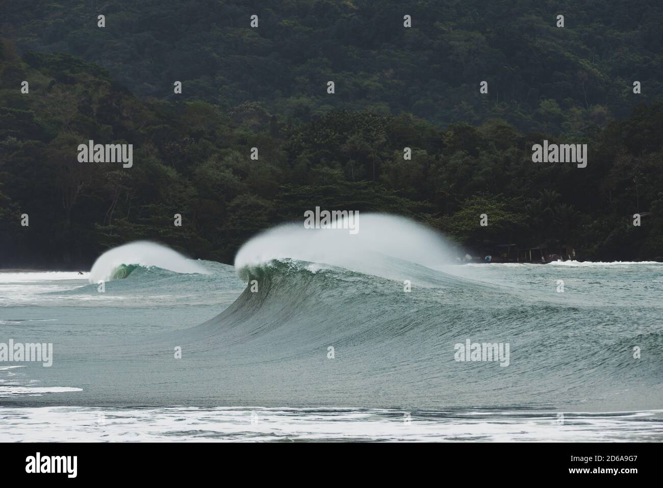A wave breaks at Castelhanos, Ilhabela, Brazil Stock Photo