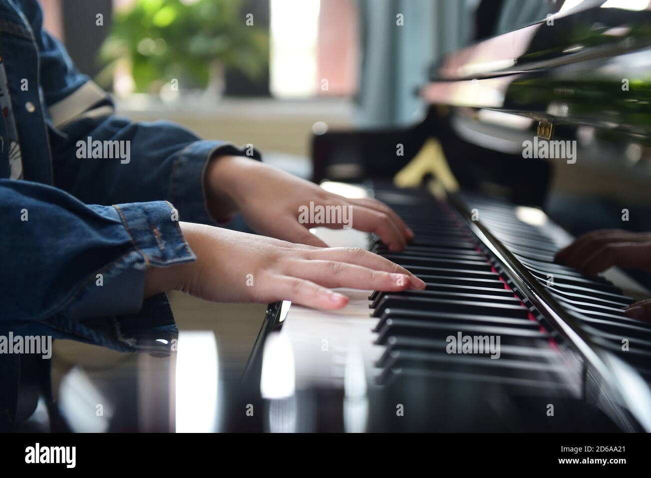 Hefei, China's Anhui Province. 12th Oct, 2020. Wang Xiangjun plays piano as  she teaches in a lesson at the Hefei Special Education Center in Hefei,  east China's Anhui Province, Oct. 12, 2020.