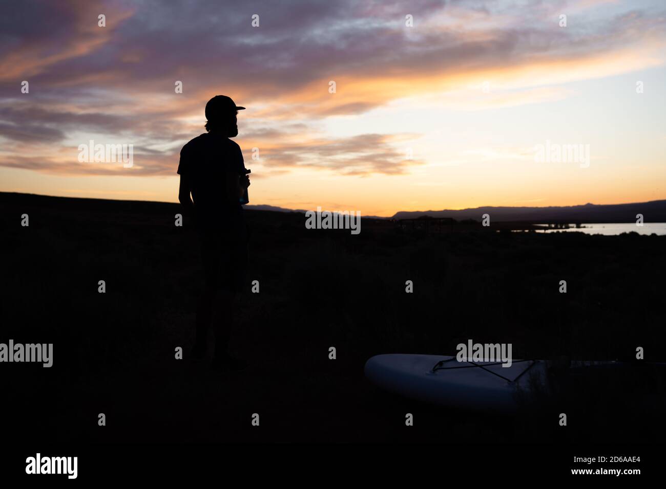 Man admires sunset at Sand Hollow State Park, Utah Stock Photo