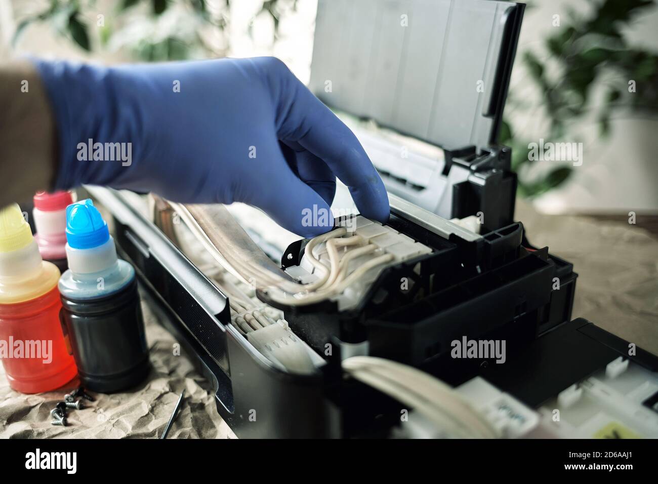 Refilling printer cartridges with multicolored ink. Background Stock