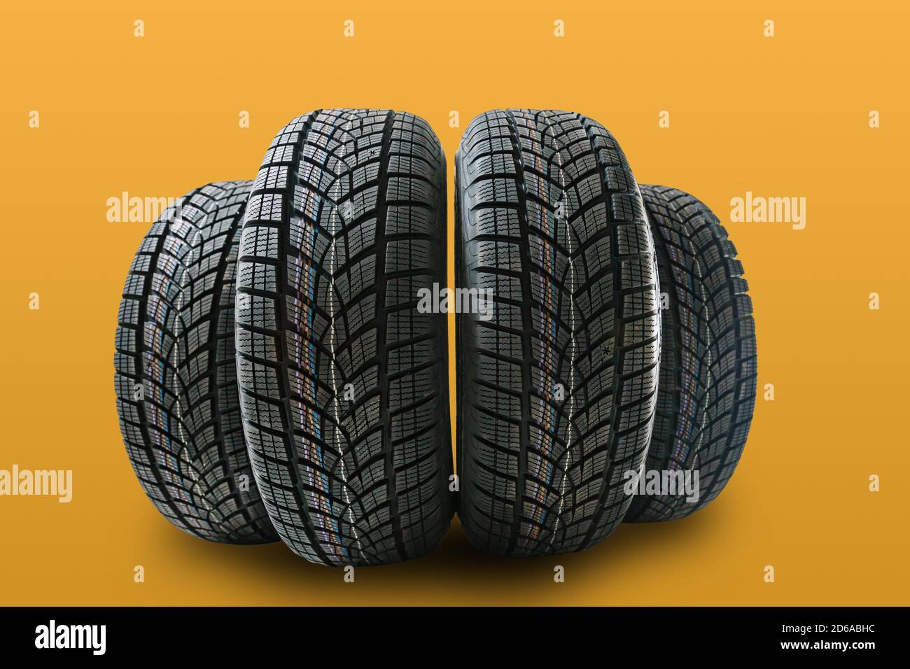 Car tires isolated on yellow background Stock Photo Alamy