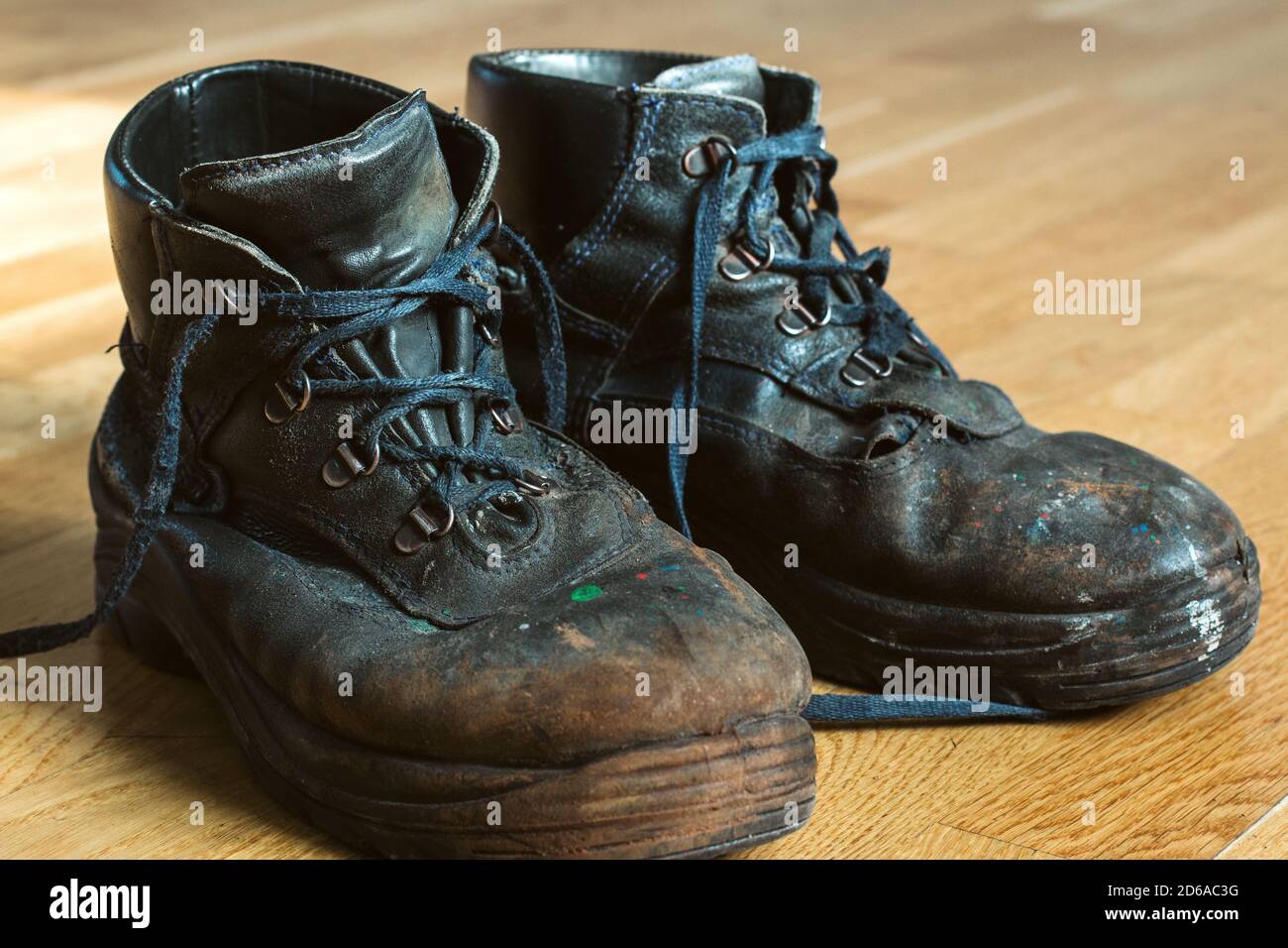 Old worn out workman s shoes. Shoes that require repair or replacement Stock Photo Alamy