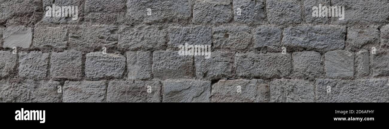 Old grey stone wall texture background. Stock Photo