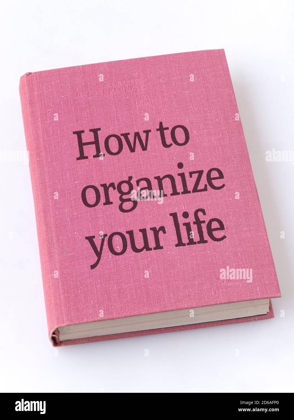 how to organize life phrase printed on textile book cover Stock Photo