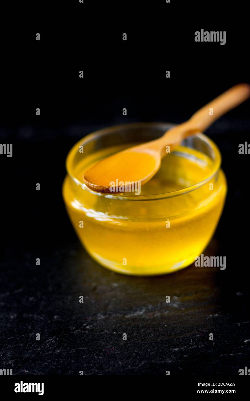Indian ghee in a transparent glass bowl Stock Photo - Alamy